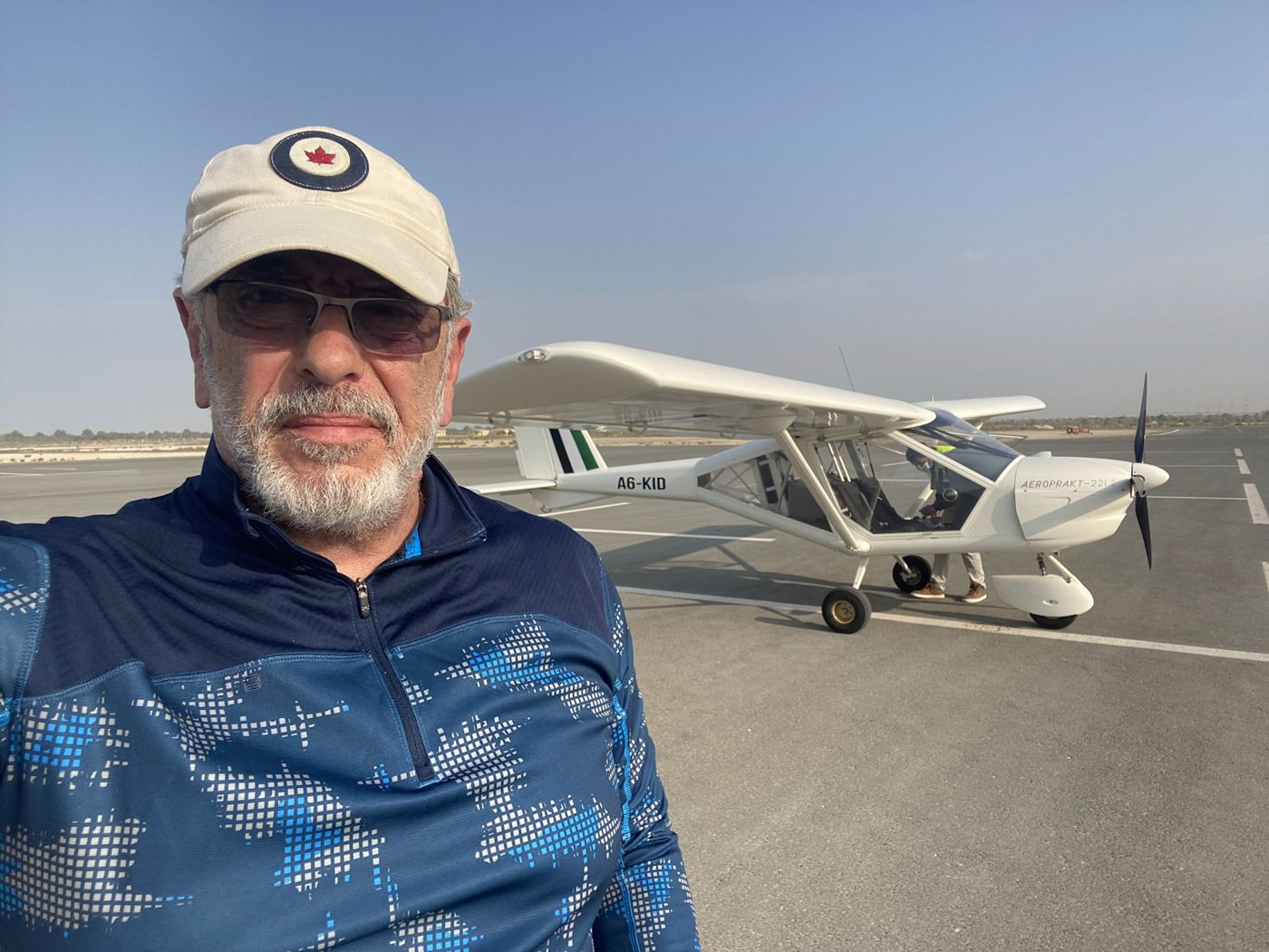 Bashar beside an Aeroprakt A22 light sport aircraft in the UAE