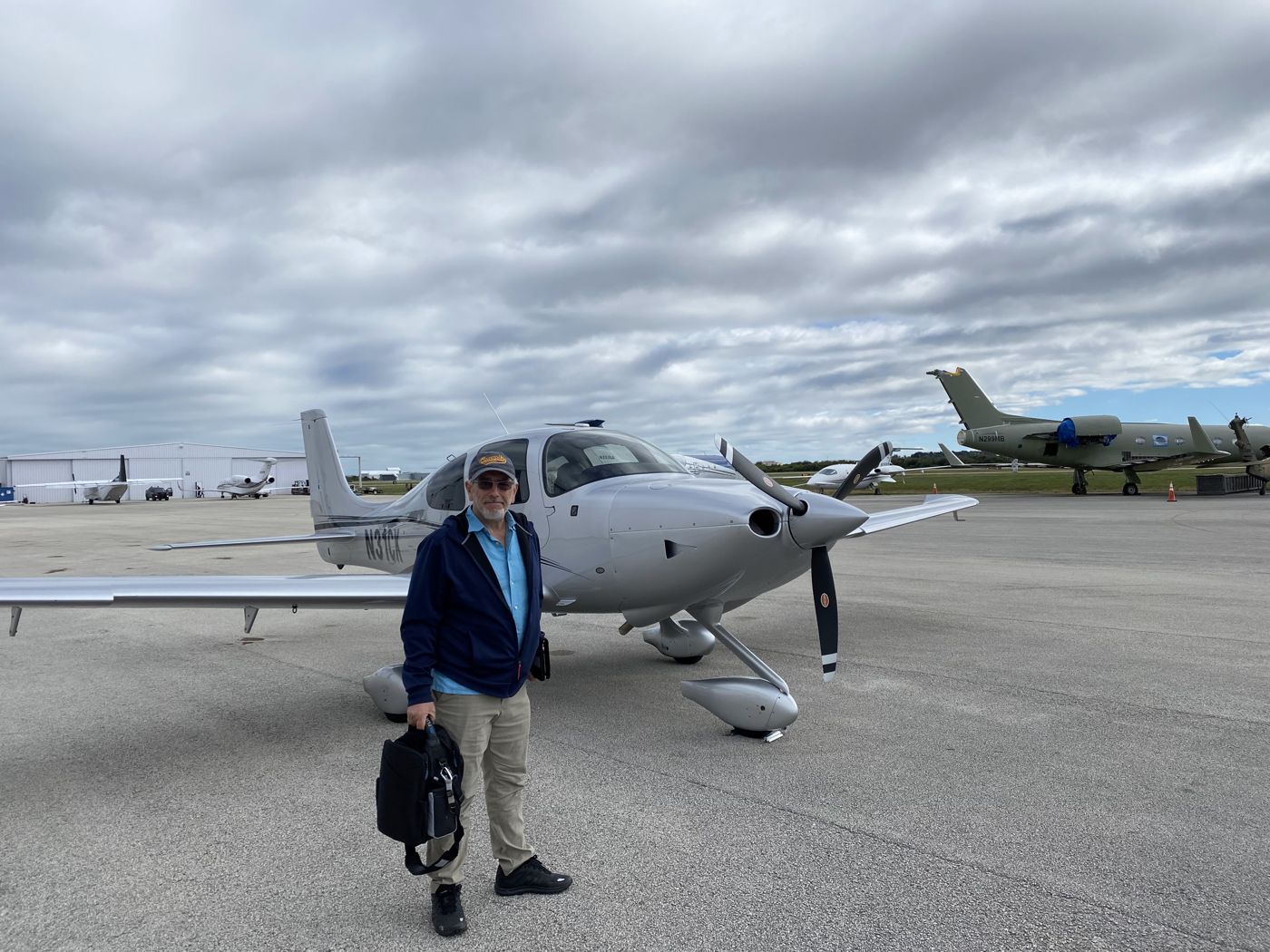 Bashar in front of a Cirrus SR22 on the ramp in Melbourne, Florida